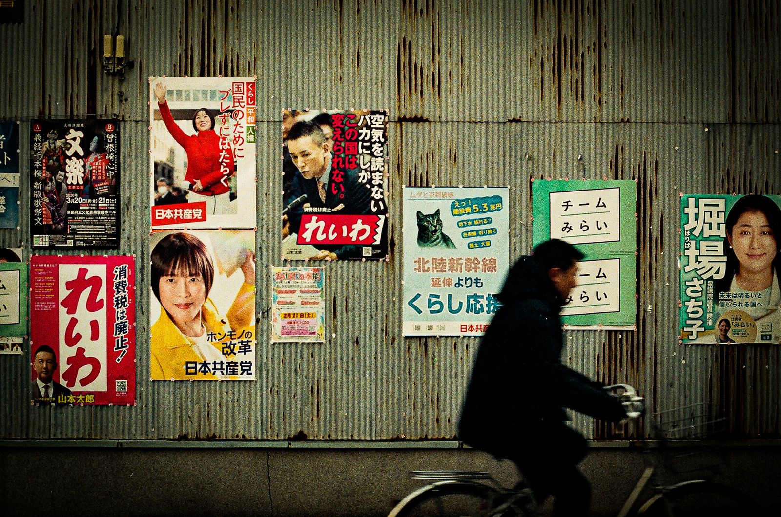 Cyclist and election posters