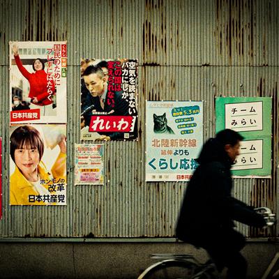 Cyclist and election posters