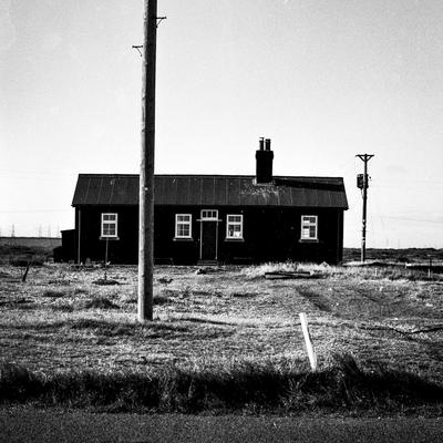 Timber cottage on shingle