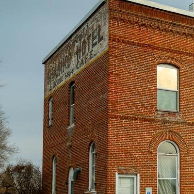 Ghost sign on a brick corner
