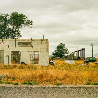 Empty building in dry grass