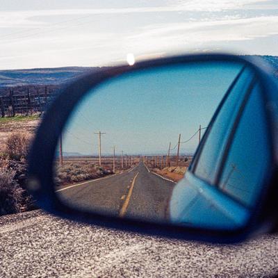 Road in a wing mirror