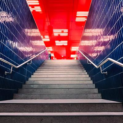 Neon-lit subway stairs